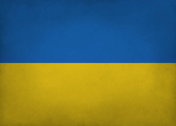 istock Ukrainian flag blue and yellow colored old paper background with vignette and copyspace 1391045519