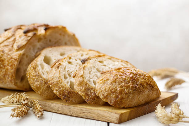 istock Slices of wheat bread on towel selective focus. 1391048045