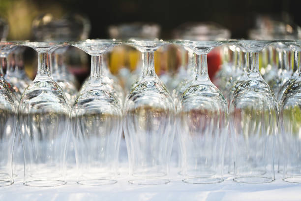 istock Set of blank empty wine glasses displayed in rows. Preparation for the holiday. 1391048206