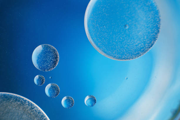 istock abstract light blue background with oil circles . bubbles of water close up . 1391048236