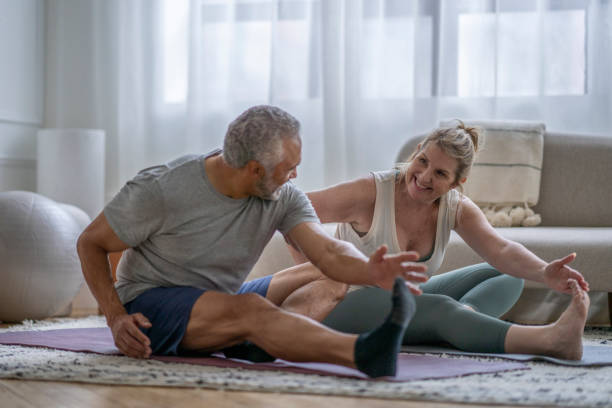 istock Senior Couple Working Out at Home 1391051257