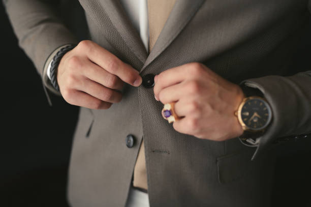 istock A man puts on a wedding suit and fastens a button 1391051480