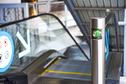 LED green light arrow Signage stainless pole in front of escalator sign the passenger the right way up and down.