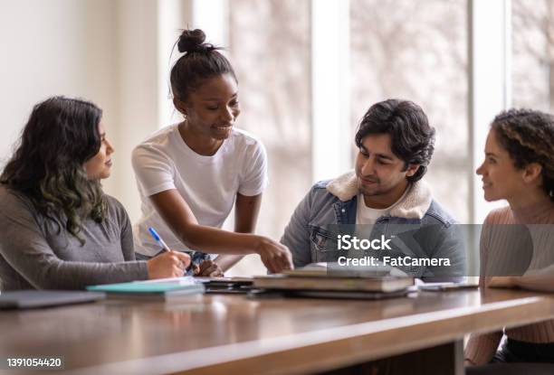 University Students Helping Each Other Stock Photo - Download Image Now - Student, Group Of People, Teenager
