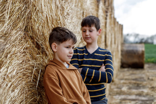 istock Children playing on bales of straw 1391056174