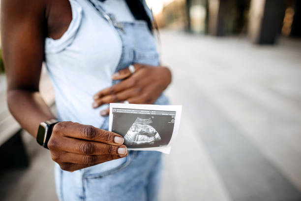 istock Pregnant showing ultrasound 1391059025