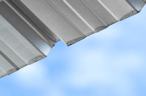 roof sheets of buildings against the backdrop of a dramatic clear sky during the day. made of mild steel
