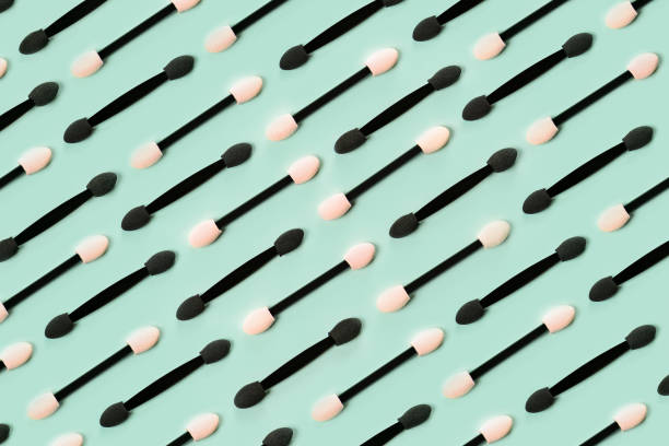 istock Set of applicators for shadows on green background. 1391060929