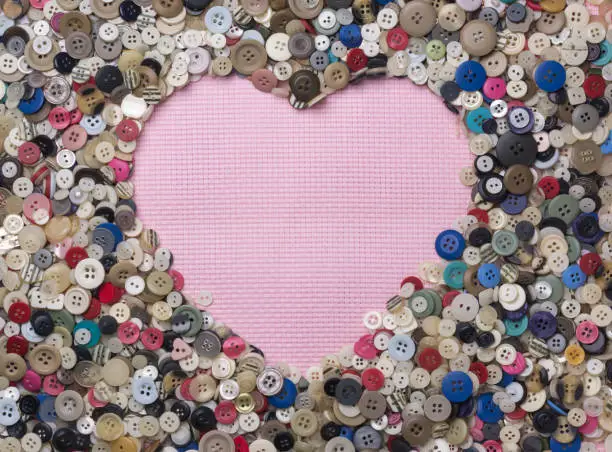 Photo of various colors and design buttons arranged in heart shape