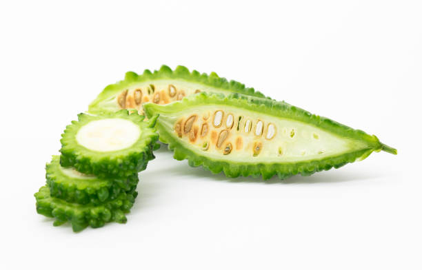 istock melon or bitter gourd slices isolated on white background, selective focus 1391062640
