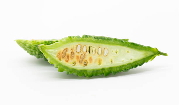 bitter gourd slices isolated on white background, selective focus stock photo