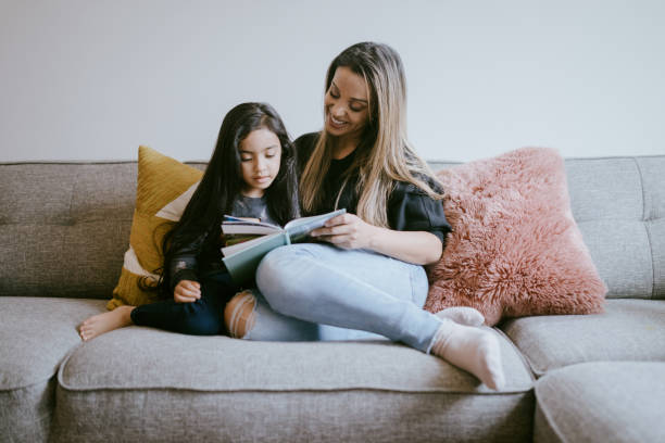 istock Mother Reading Her Young Daughter A Book 1391063535