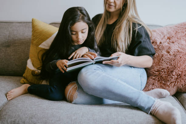istock Mother Reading Her Young Daughter A Book 1391063549