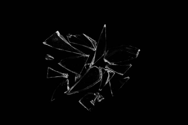 istock Shards of broken glass on a black background. 1391064570