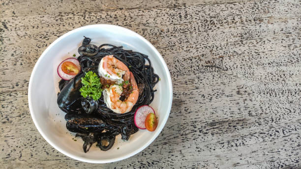 istock Black squid spaghetti with shrimp, squid, mussels 1391065252