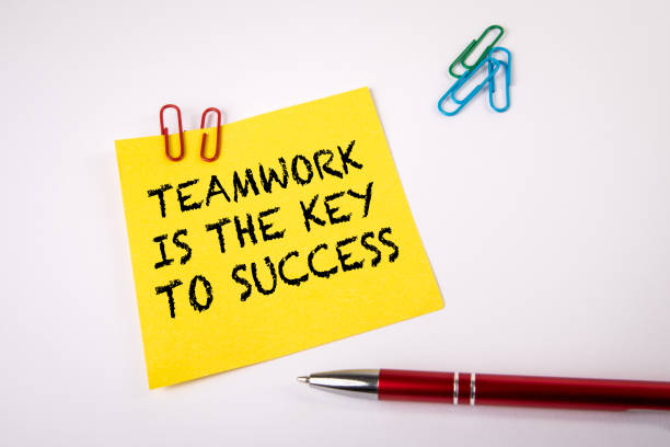 istock Teamwork is the Key to Success. Pen and note with text on a white background 1391066723