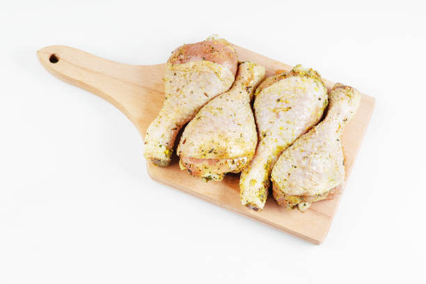 istock Cooking chicken drumsticks.BBQ drumstick.Semifinished. Fast cooking.Raw marinated chicken meat.Chicken drumstick marinated with fresh spices.Isolade. 1391067295