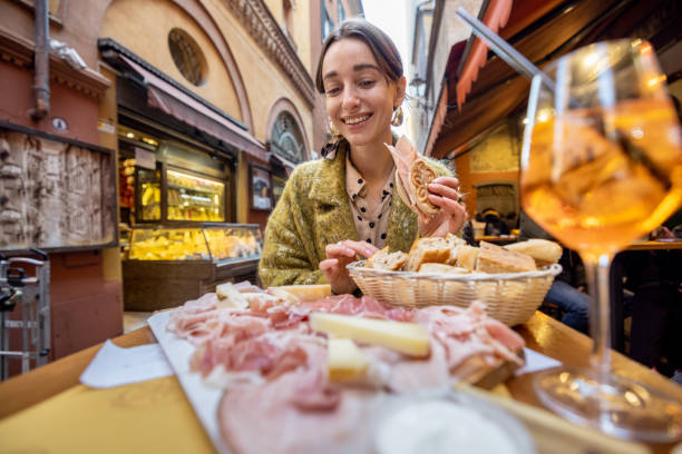 Woman with Italian snacks and drink at bar outdoors stock photo