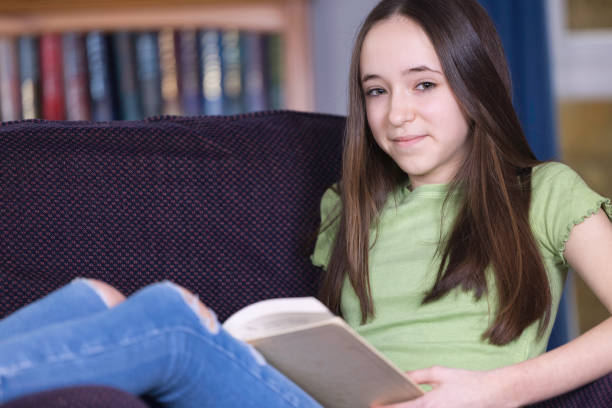 istock Teen girl reading in her study 1391071180
