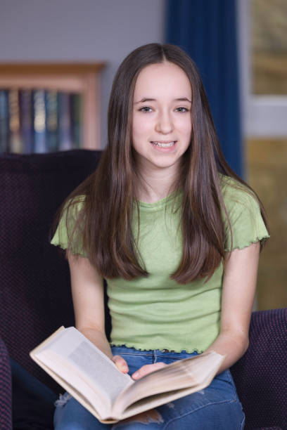 istock Teen girl reading in her study 1391071212
