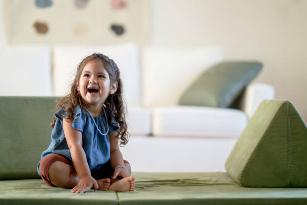 istock Little Hispanic Girl Playing at Home 1391073573