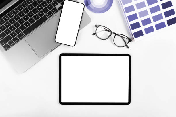 istock iPad pro with white screen on white color background. Flatlay. Office background 1391075126