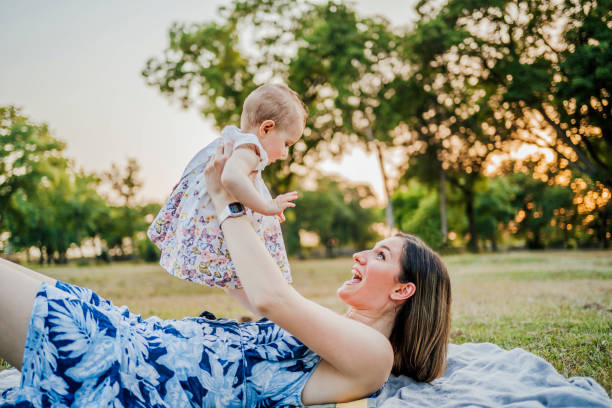 istock Mother playing with her daughter outdoor 1391079961