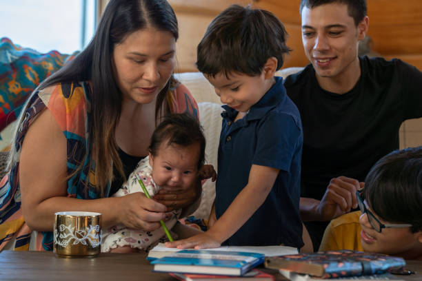 istock Little Boy Coloring With His Family 1391081208