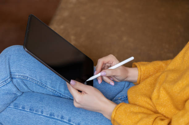 istock Girl working at home with a tablet during quarantine 1391081256