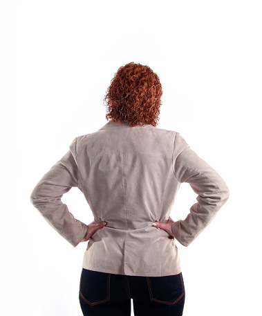 Rer view of a young woman with long straigth hair on a white background