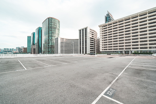 Empty floor with modern skyline and buildings in Hong Kong