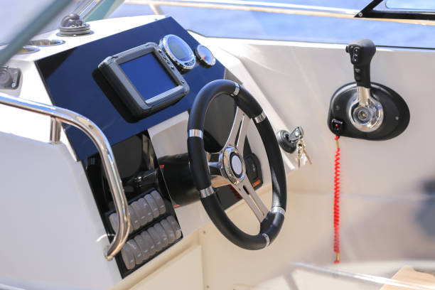 istock Cockpit motor boat with steering wheel and throttle control 1391085281