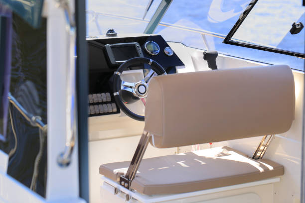 istock Cockpit motor boat with steering wheel and throttle control 1391085288