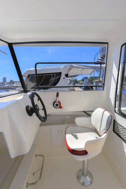 istock Cockpit motor boat with steering wheel and throttle control 1391085290