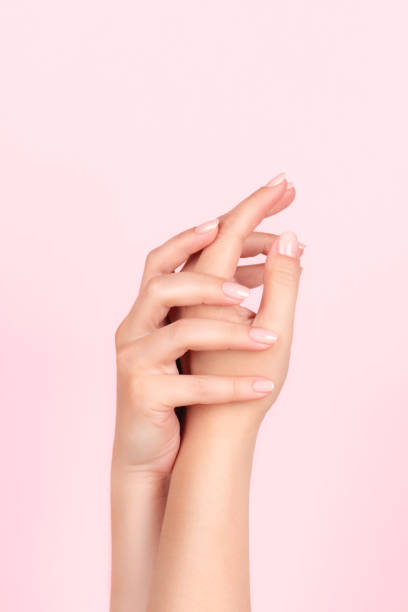 istock Female hands with nude nails 1391085742