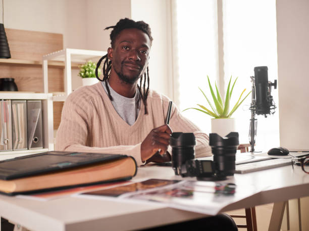istock Graphic designer/photographer working in home office 1391086499
