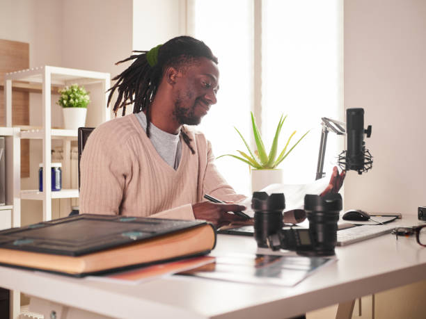 istock Graphic designer/photographer working in home office 1391086502