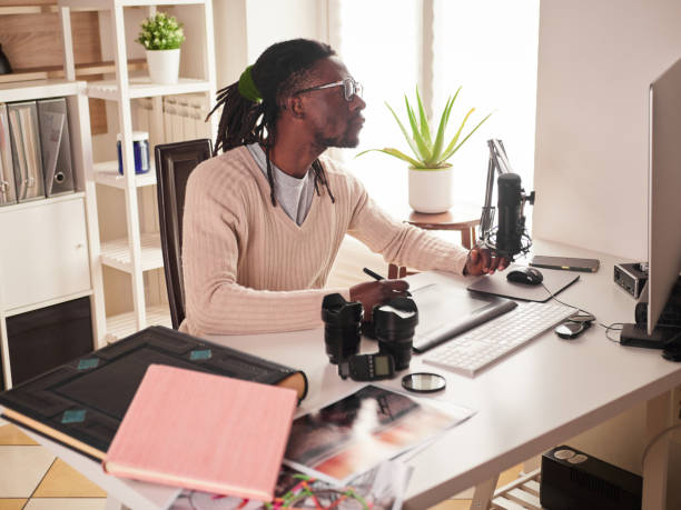 istock Graphic designer/photographer working in home office 1391086568