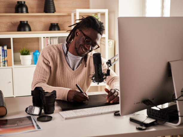 istock Graphic designer/photographer working in home office 1391086585