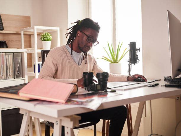 istock Graphic designer/photographer working in home office 1391086604