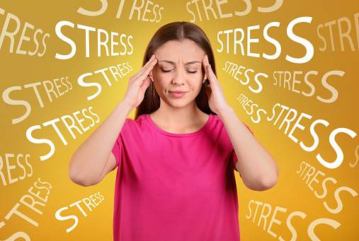 Stressed young woman and text on yellow background