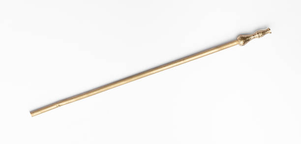 istock golden magic staff isolated on white background 1391087199