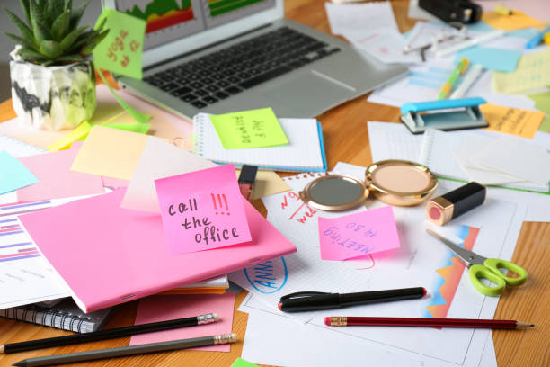 istock Messy table with laptop and cosmetics. Concept of being overwhelmed by work 1391088007