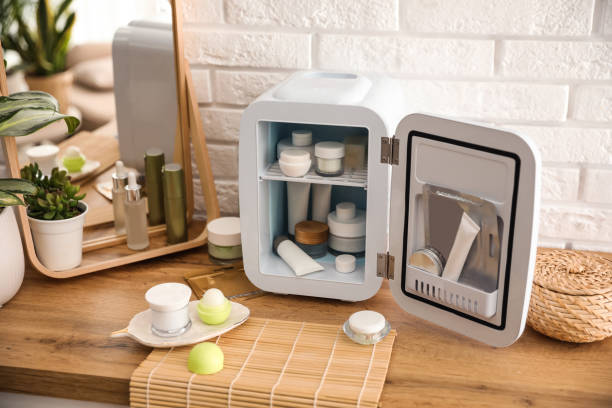 istock Mini fridge with cosmetic products on wooden vanity table 1391088185