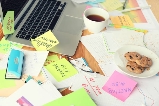 istock Messy table with laptop and cookies. Concept of being overwhelmed by work 1391088241