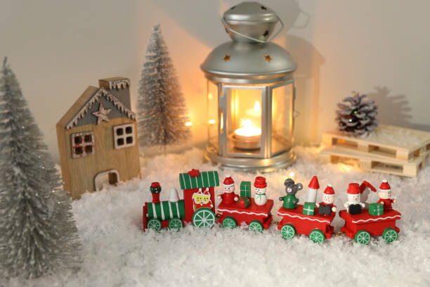 istock Toy train and Christmas decor on snow 1391088279