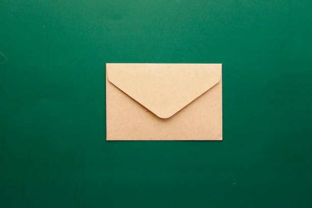 istock a envelope drops on a green color background 1391088346