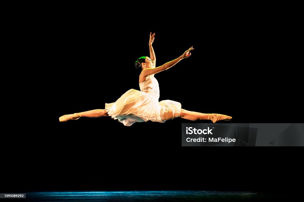 Teenage girl dancing Neoclassical ballet on stage Ballet Stock Photo