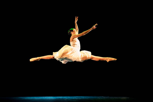 teenage girl dancing neoclassical ballet on stage - dancer jumping ballet dancer ballet imagens e fotografias de stock