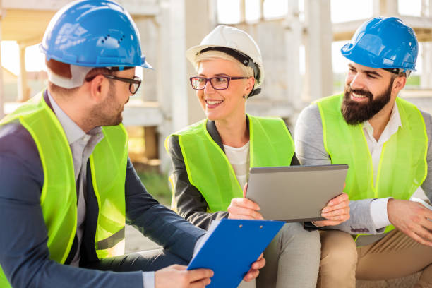 istock Team of young architects having a meeting on a construction site 1391089316